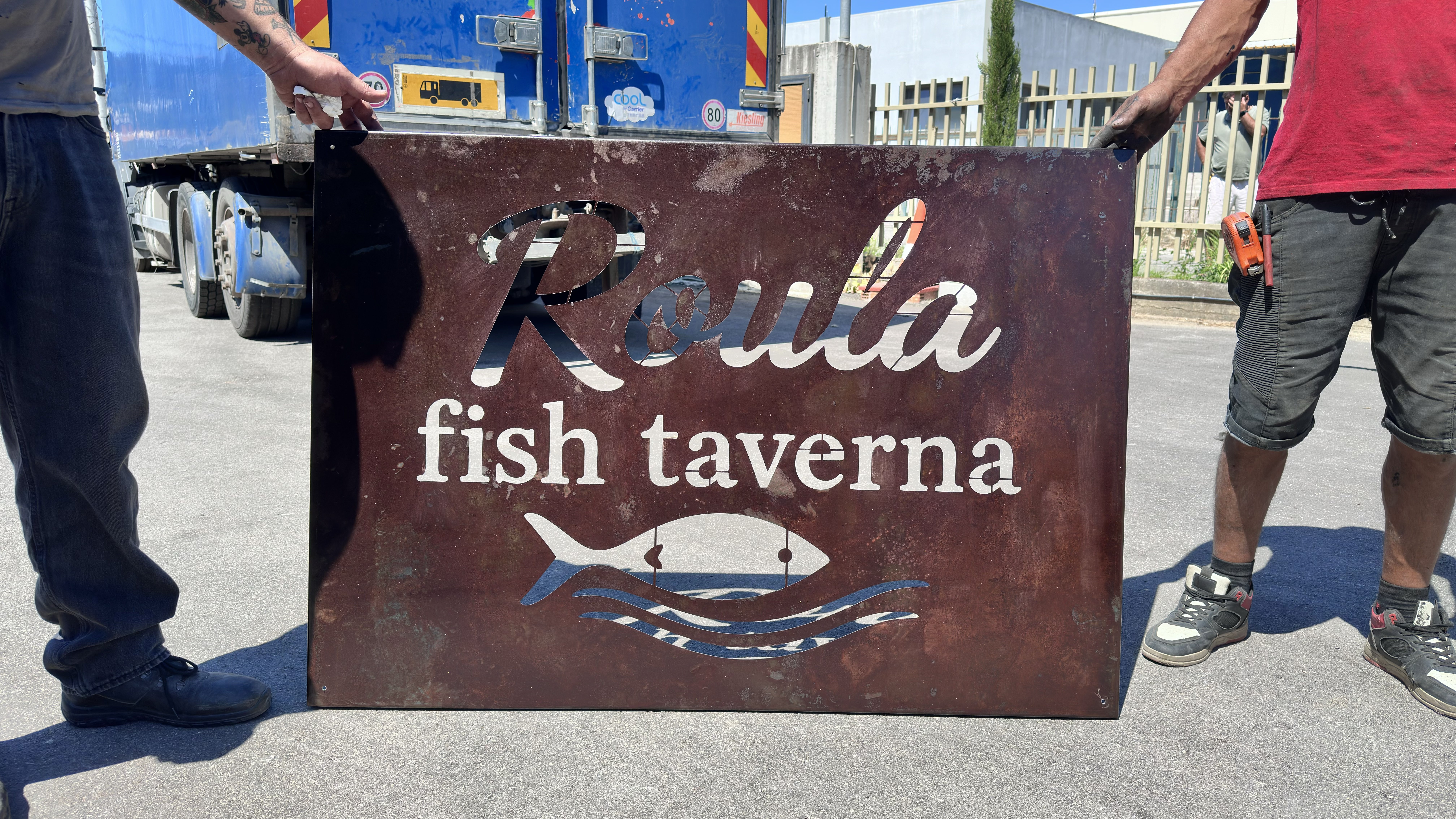 Laser cut sign for a Taverna in Corfu. Rusted naturally and cut using a fiber laser